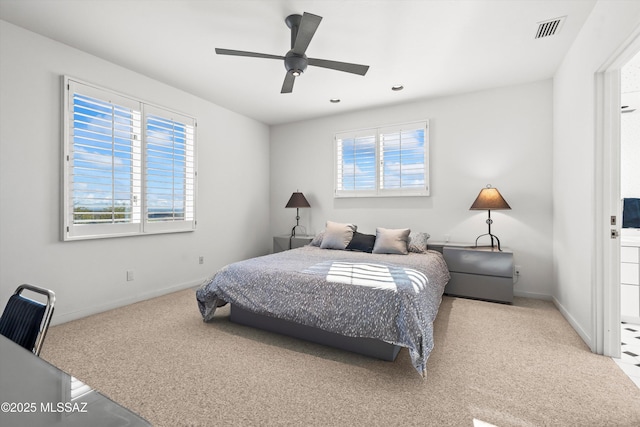 carpeted bedroom with ceiling fan