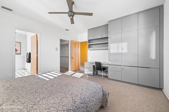 bedroom featuring ceiling fan and ensuite bathroom