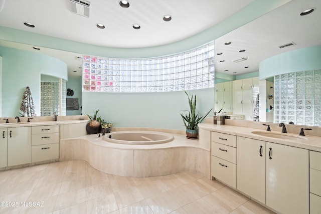 bathroom with vanity, tile patterned floors, and separate shower and tub