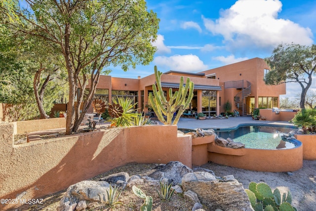 view of swimming pool with a patio area