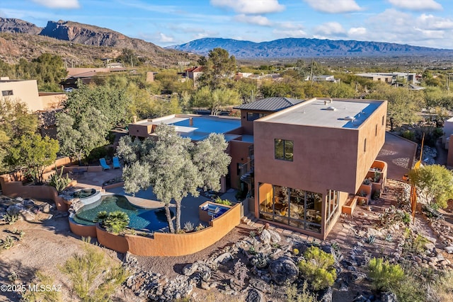 birds eye view of property featuring a mountain view