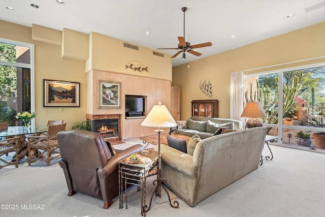 living room featuring light carpet and ceiling fan