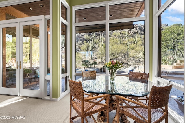 sunroom featuring french doors