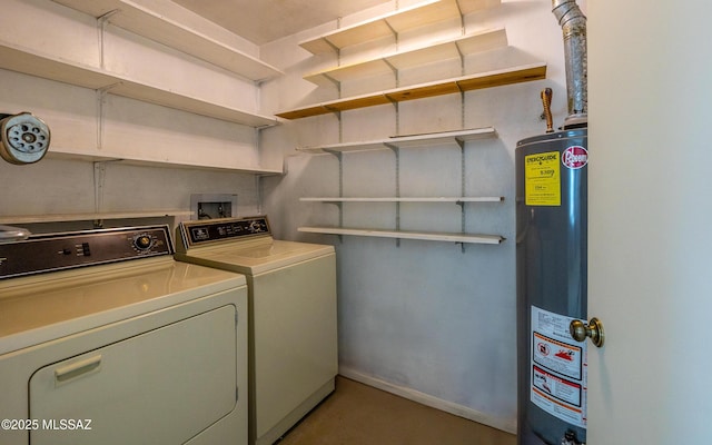 clothes washing area featuring washer and clothes dryer and gas water heater