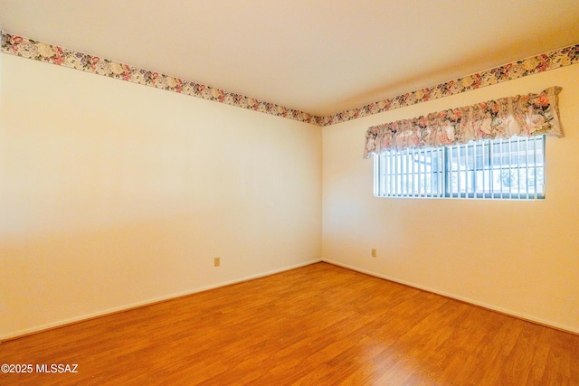 empty room featuring hardwood / wood-style flooring