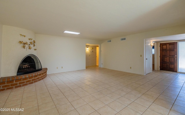 unfurnished living room with light tile patterned floors