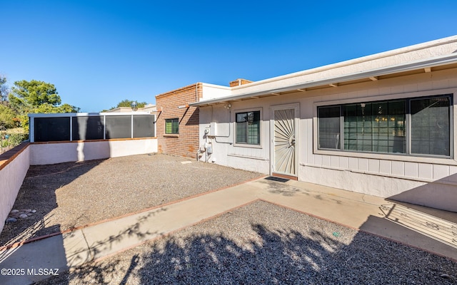 rear view of house with a patio