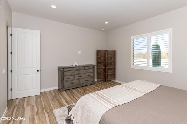 bedroom with light hardwood / wood-style floors