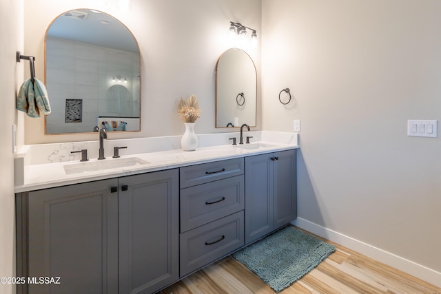 bathroom featuring hardwood / wood-style floors and vanity