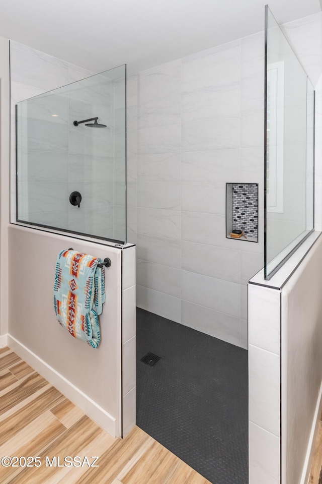 bathroom with a tile shower