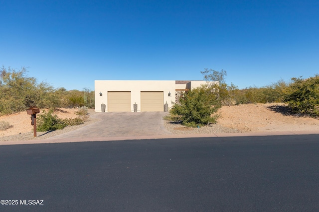 southwest-style home featuring a garage