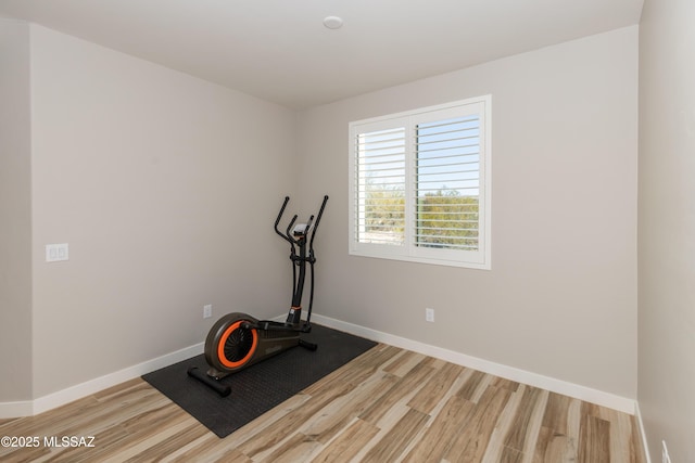 exercise area featuring hardwood / wood-style flooring