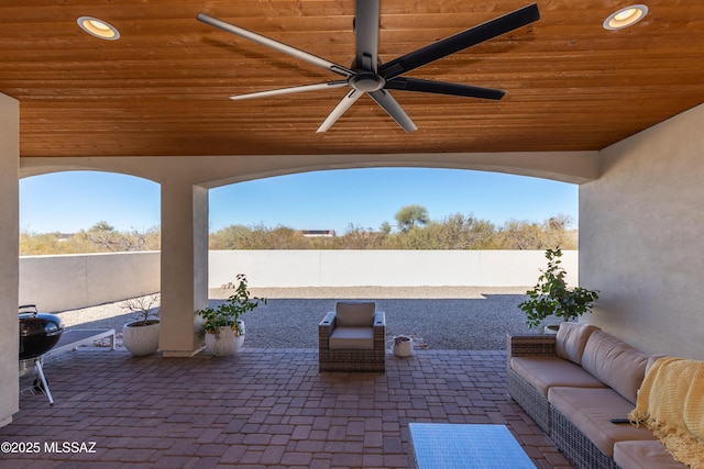 view of patio featuring ceiling fan