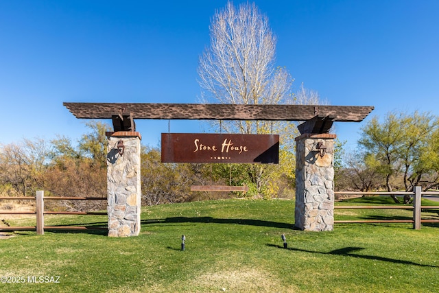 community / neighborhood sign featuring a lawn