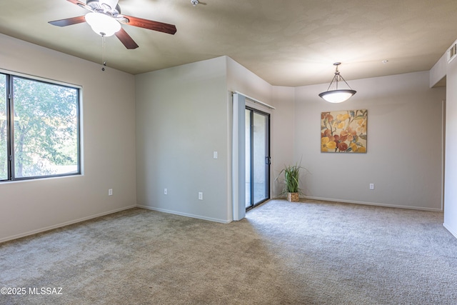 carpeted empty room with ceiling fan