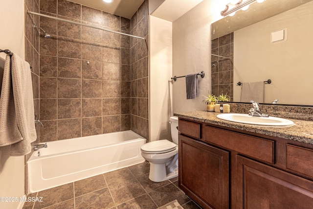 full bathroom featuring vanity, toilet, and tiled shower / bath