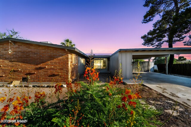 exterior space with a carport