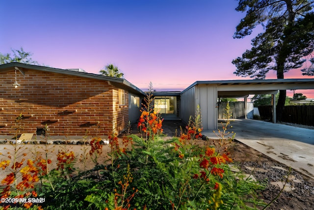 exterior space featuring a carport