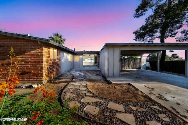 exterior space featuring a carport