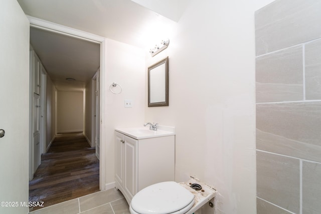 bathroom with vanity, tile patterned floors, and toilet