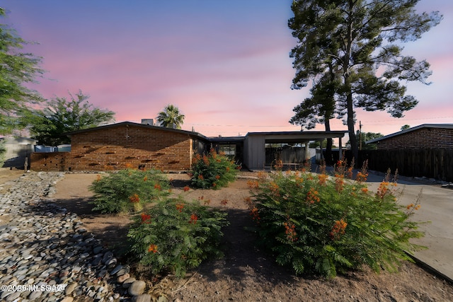 view of front facade with a carport