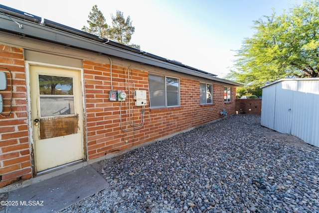 view of property exterior featuring a storage unit