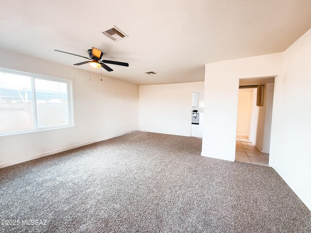 carpeted empty room with ceiling fan