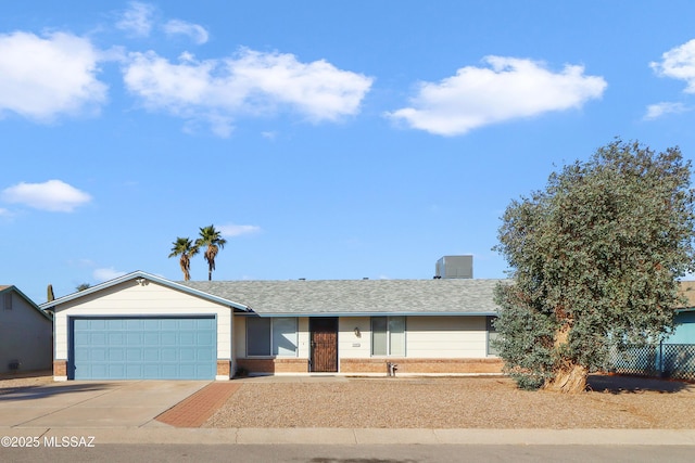 ranch-style house featuring a garage