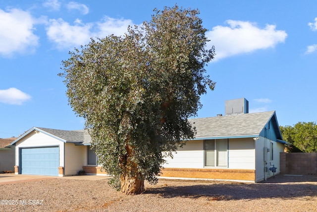 ranch-style house featuring a garage