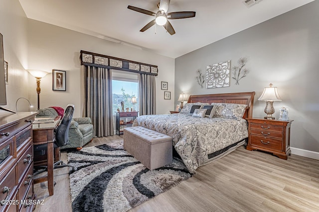 bedroom with ceiling fan and light hardwood / wood-style floors