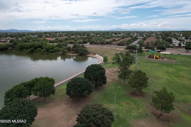 birds eye view of property with a water and mountain view