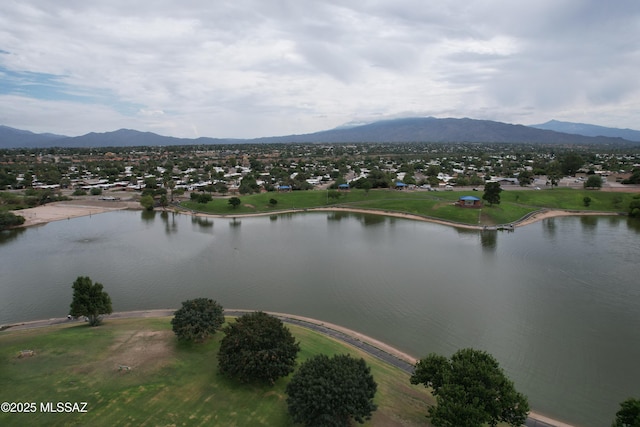 birds eye view of property featuring a water and mountain view