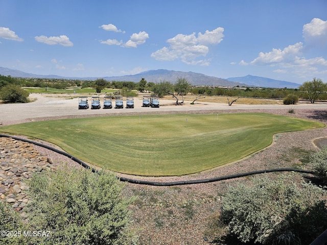 view of home's community featuring a mountain view and golf course view