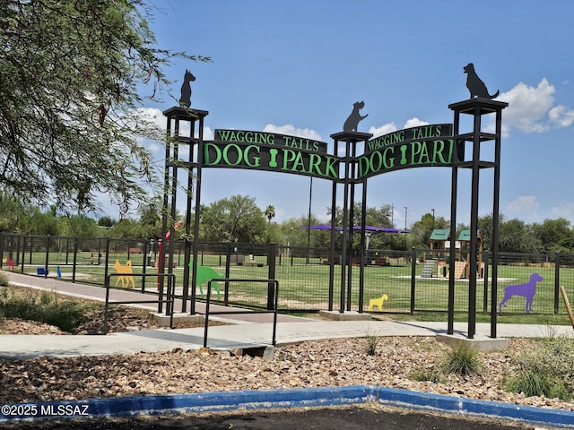 view of home's community with a playground and a yard