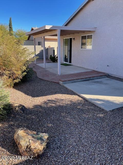 back of property with a patio area