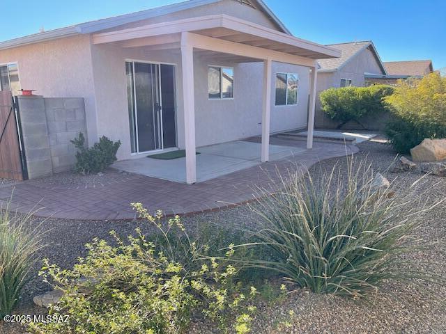 back of house with a patio area