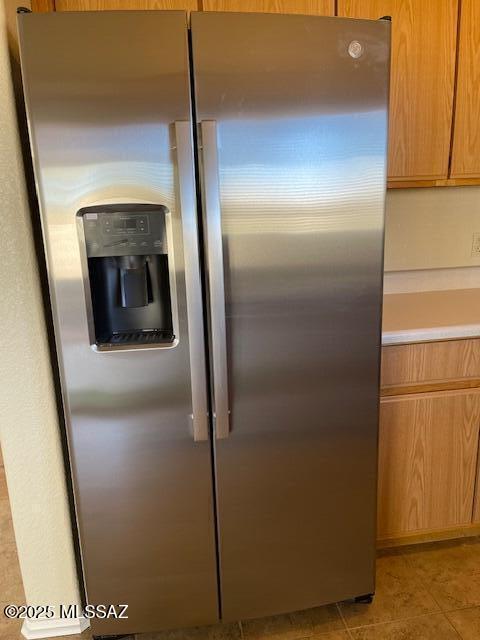 interior details with stainless steel fridge with ice dispenser