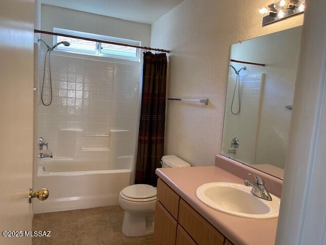 full bathroom with shower / bath combo, toilet, and vanity