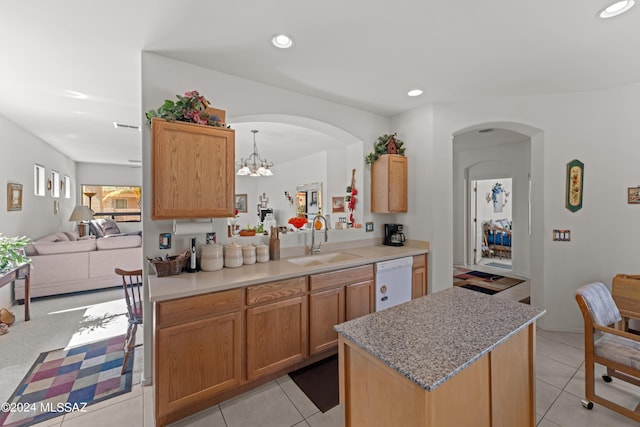 kitchen featuring dishwasher, light tile patterned floors, a sink, and recessed lighting