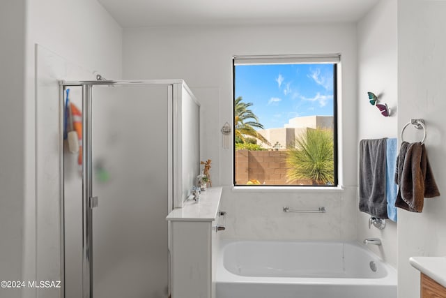 full bathroom featuring a garden tub and a shower stall