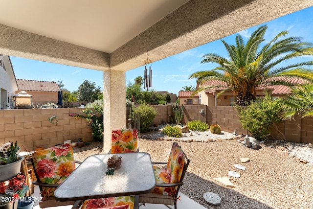 view of patio / terrace featuring outdoor dining area and a fenced backyard