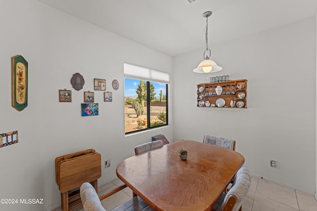 dining area featuring light tile patterned floors