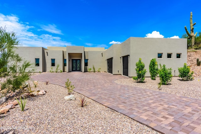 pueblo-style house with french doors