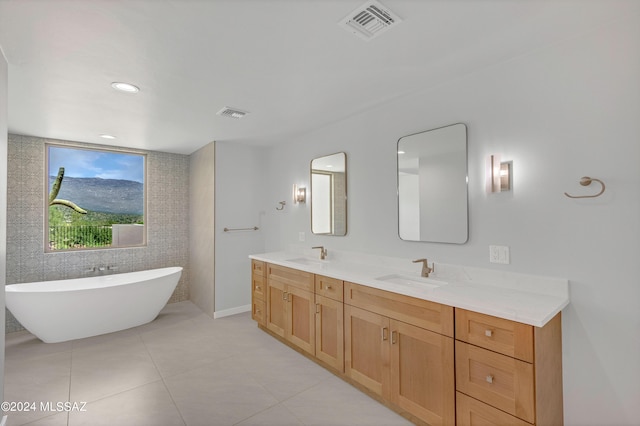 14821 E Diamond F Rnch Pl, Vail, AZ 85641 - full bath with double vanity, visible vents, a freestanding tub, and a sink