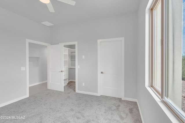 14821 E Diamond F Rnch Pl, Vail, AZ 85641 - unfurnished bedroom featuring carpet flooring, baseboards, a walk in closet, and ceiling fan