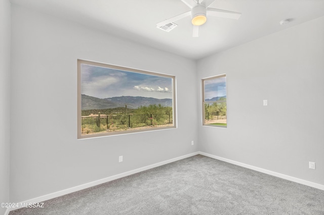 14821 E Diamond F Rnch Pl, Vail, AZ 85641 - carpeted empty room with baseboards, ceiling fan, visible vents, and a mountain view