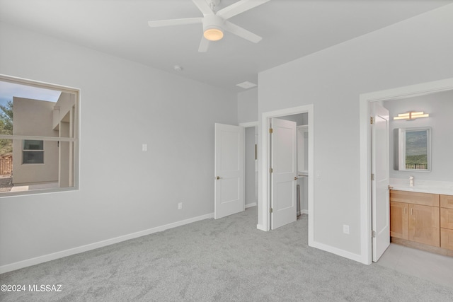 14821 E Diamond F Rnch Pl, Vail, AZ 85641 - unfurnished bedroom featuring a walk in closet, light carpet, ensuite bath, and baseboards