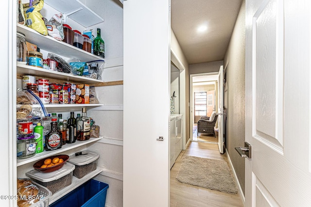 pantry featuring washer and dryer