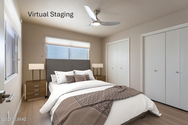 bedroom featuring light hardwood / wood-style flooring, ceiling fan, and multiple closets