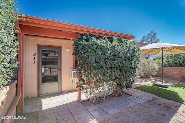 entrance to property featuring a patio area